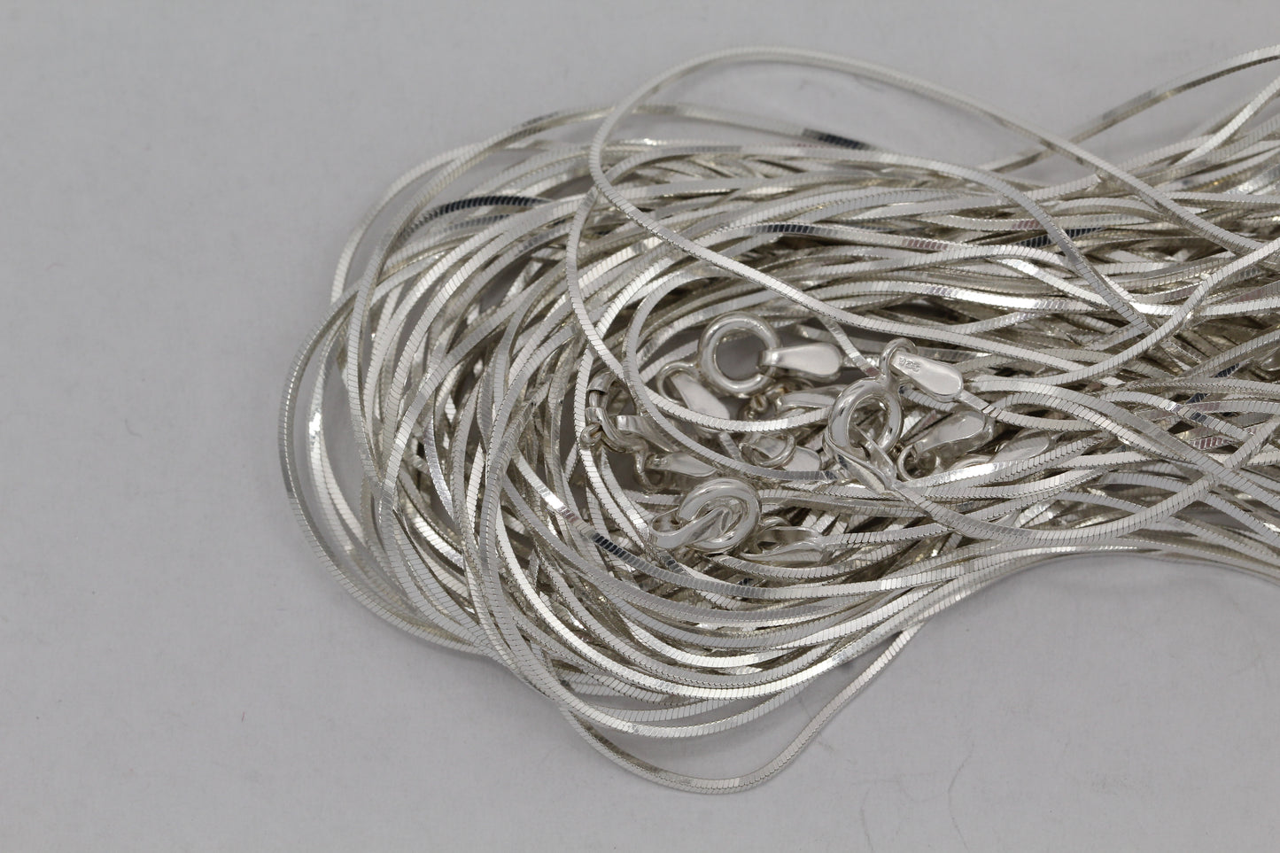Sterling Silver, 0.75mm Width / Length, 16 Inch Square Regular Snake Chain with 6.0mm Width / Length by 1.4mm Thick, Smooth Spring Ring Clasp and Tags Ends. Quantity Per Pack: 1 Piece.