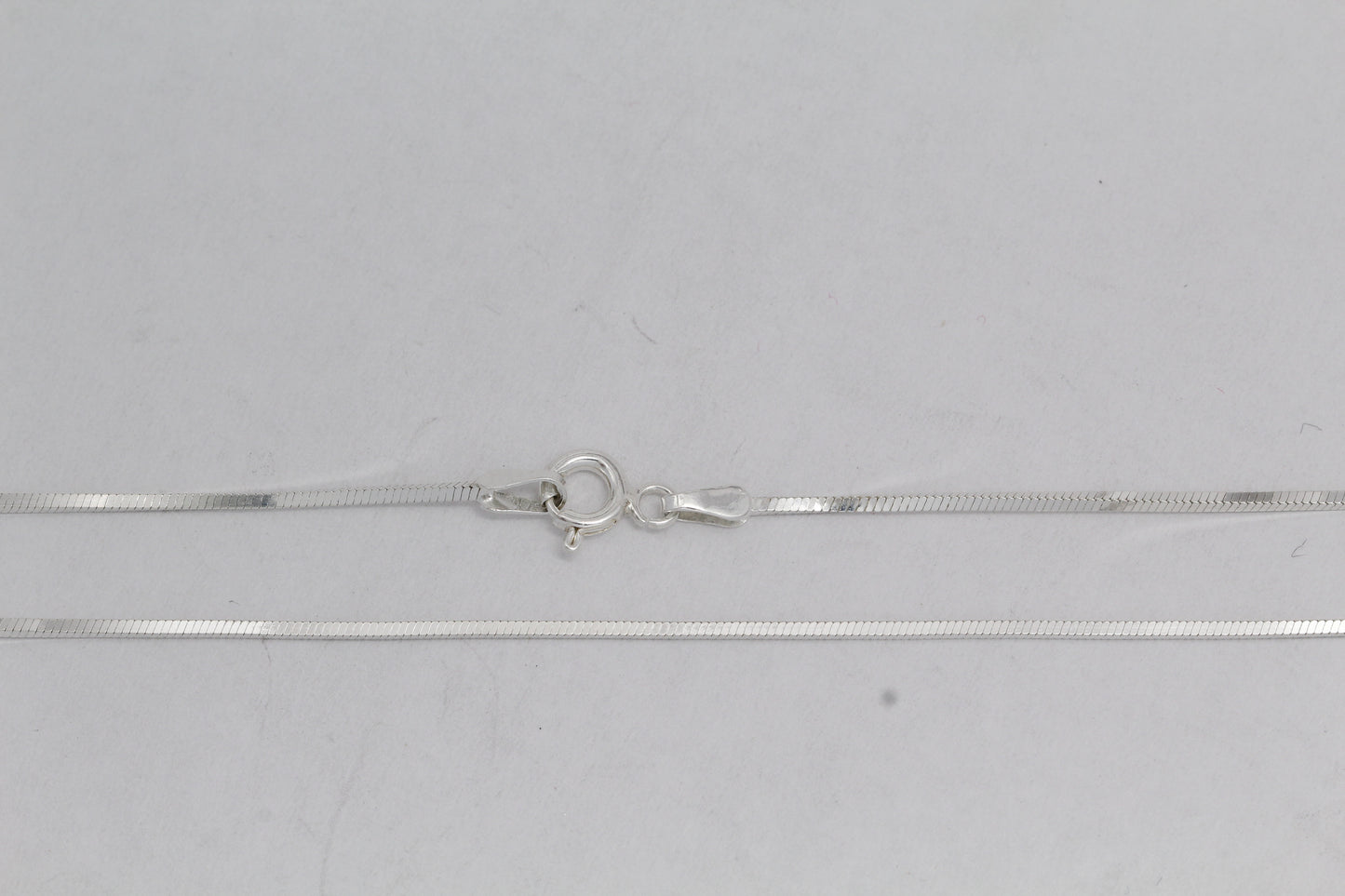 Sterling Silver, 1.0mm Width / Length, 16 Inch Square Regular Snake Chain with 6.0mm Width / Length by 1.4mm Thick, Smooth Spring Ring Clasp and Tags Ends. Quantity Per Pack: 1 Piece.