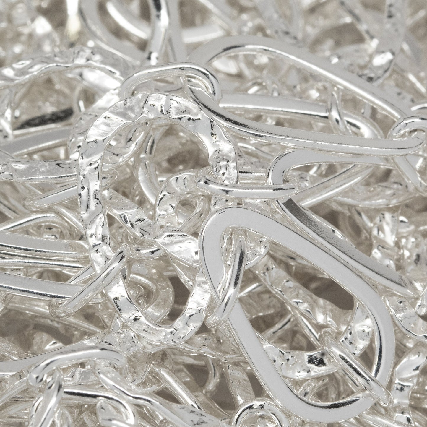Sterling Silver 11.0mm Width by 17.0mm Length Flat and Hammered Pear Shaped Links Connected by 4.2mm Width by 7.3mm Length Elongated Oval Link, Long and Short Chain. Price per: 1 Foot.