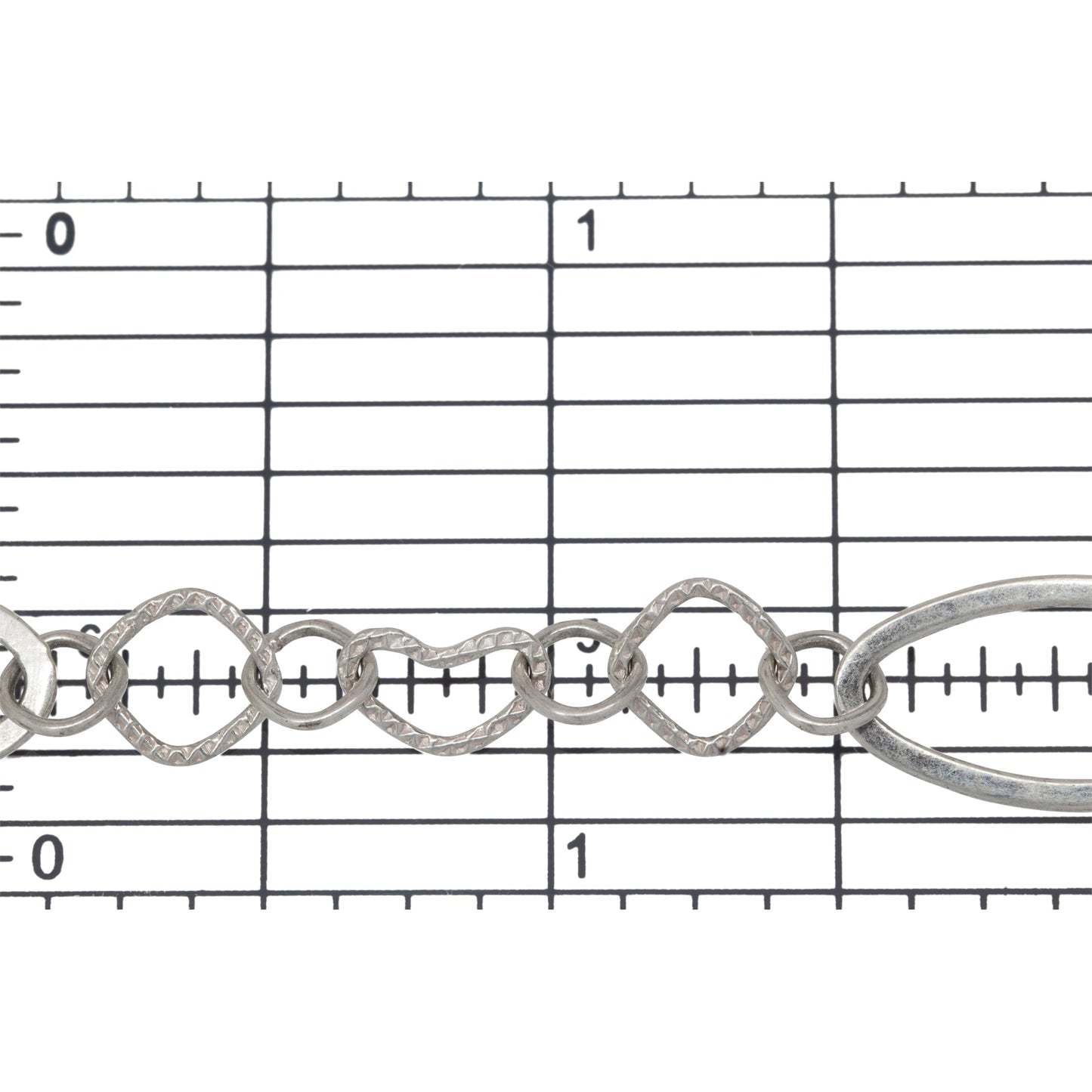 Sterling Silver 10.4mm Width by 20.4mm Length Flat Elongated Oval, Two of 8.1mm Width/Length Textured Diamond Shaped, 6.8mm Width by 9.7mm Length Textured Heart Link, Connected by Diamond Shaped Link, Fancy Chain. Price per: 1 Foot.
