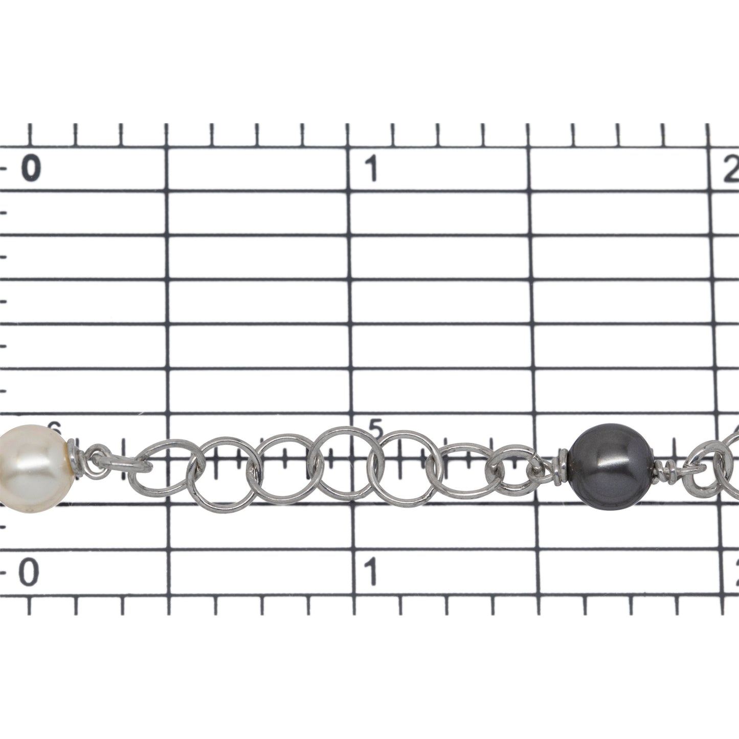 Sterling Silver Rhodium Plated Two of 4.12mm Width / Length Smooth Circle Connected with Two of 6.02mm Width / Length Swarovski Pearls, followed by Six of 5.34mm Width / Length Smooth Circle Links of Circle Chain. Price per: 1 Inch.