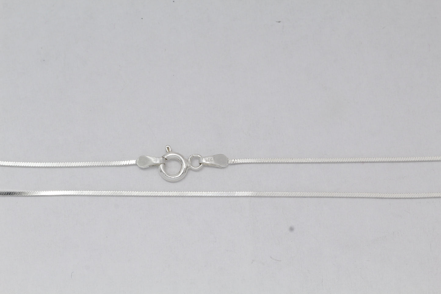 Sterling Silver, 0.8mm Width / Length, 16 Inch Square Regular Snake Chain with 6.0mm Width / Length by 1.4mm Thick, Smooth Spring Ring Clasp and Tags Ends. Quantity Per Pack: 1 Piece.
