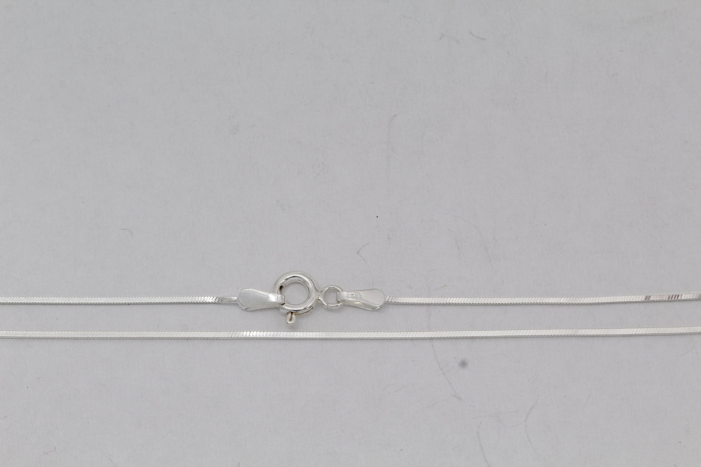 Sterling Silver, 0.75mm Width / Length, 16 Inch Square Regular Snake Chain with 6.0mm Width / Length by 1.4mm Thick, Smooth Spring Ring Clasp and Tags Ends. Quantity Per Pack: 1 Piece.