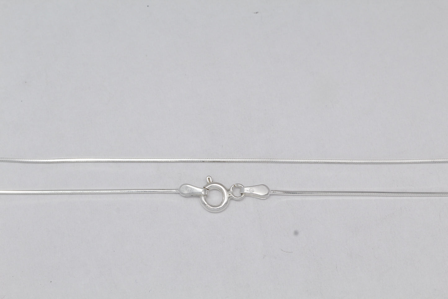 Sterling Silver, 0.7mm Width / Length, 18 Inch Square Regular Snake Chain with 6.0mm Width / Length by 1.4mm Thick, Smooth Spring Ring Clasp and Tags Ends. Quantity Per Pack: 1 Piece.