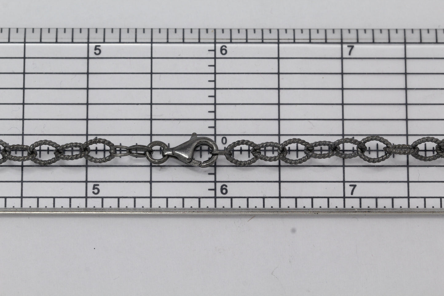 Sterling Silver Black Diamond, 5.4mm Width by 7.2mm Length, 24 Inch Twisted Cable Chain with 11.0mm Length by 3.0mm Thick, Trigger Lobster Clasp. Quantity Per Pack: 1 Piece.