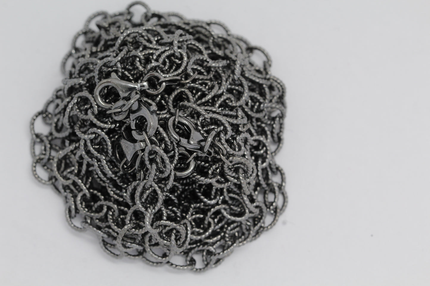 Sterling Silver Black Diamond, 5.4mm Width by 7.2mm Length, 24 Inch Twisted Cable Chain with 11.0mm Length by 3.0mm Thick, Trigger Lobster Clasp. Quantity Per Pack: 1 Piece.