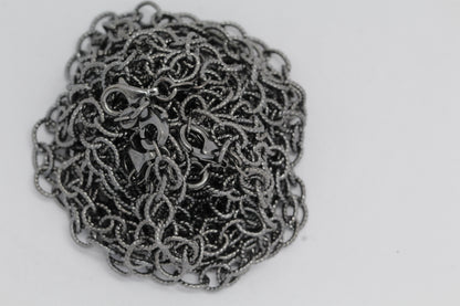 Sterling Silver Black Diamond, 5.4mm Width by 7.2mm Length, 24 Inch Twisted Cable Chain with 11.0mm Length by 3.0mm Thick, Trigger Lobster Clasp. Quantity Per Pack: 1 Piece.