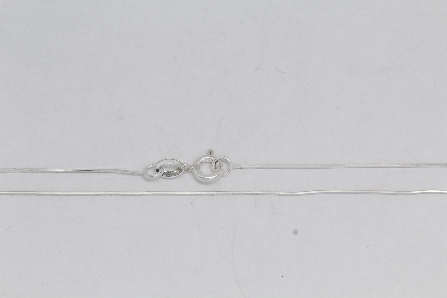 Sterling Silver, 0.7mm Width / Length, 16 Inch Square Regular Snake Chain with 6.0mm Width / Length by 1.4mm Thick, Smooth Spring Ring Clasp. Quantity Per Pack: 1 Piece.