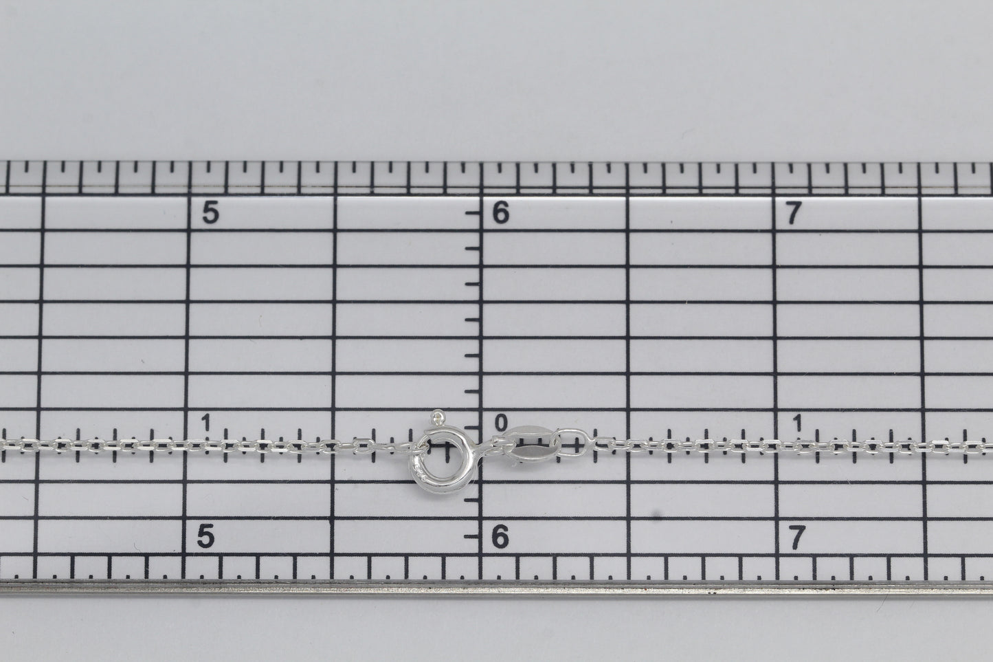 Sterling Silver, 1.4mm Width by 2.2mm Length, 18 Inch Flat Cable Chain with 6.0mm Width / Length by 1.4mm Thick, Smooth Spring Ring Clasp. Quantity Per Pack: 1 Piece.