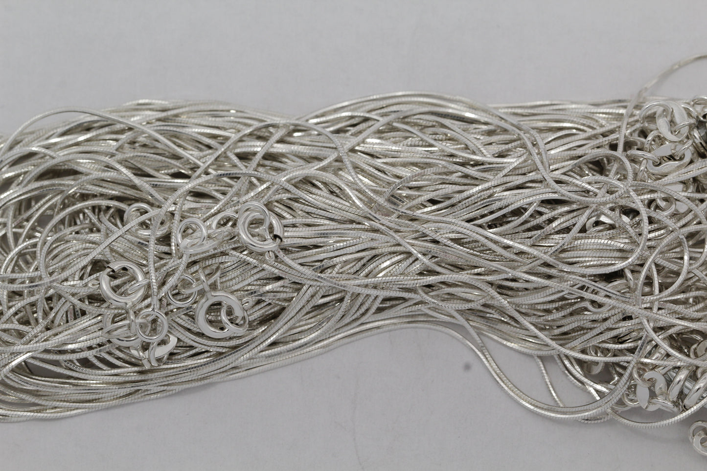 Sterling Silver, 0.7mm Width / Length, 16 Inch Square Regular Snake Chain with 6.0mm Width / Length by 1.4mm Thick, Smooth Spring Ring Clasp. Quantity Per Pack: 1 Piece.