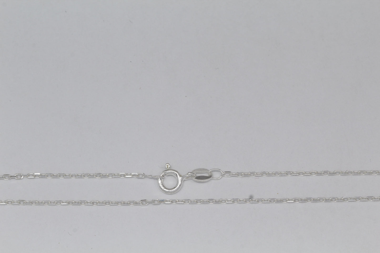 Sterling Silver, 1.4mm Width by 2.2mm Length, 18 Inch Flat Cable Chain with 6.0mm Width / Length by 1.4mm Thick, Smooth Spring Ring Clasp. Quantity Per Pack: 1 Piece.