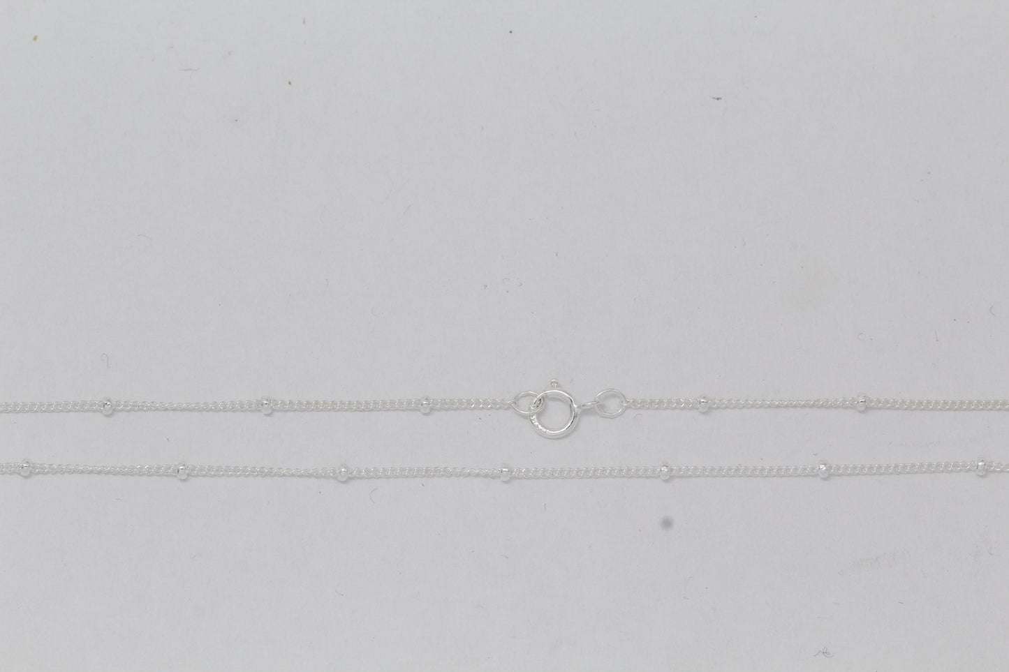 Sterling Silver, 1.0mm Width by 1.9mm Length, 16 Inch Regular Satellite Chain with 5.0mm Width / Length by 1.0mm Thick, Smooth Spring Ring Clasp. Quantity Per Pack: 1 Piece.