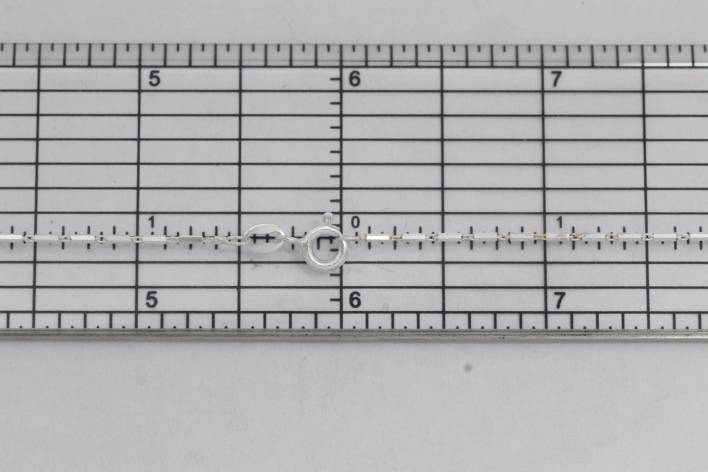 Sterling Silver, 1.1mm Width by 4.3mm Length, 18 Inch Regular Bar Chain with 6.0mm Width / Length by 1.4mm Thick, Smooth Spring Ring Clasp. Quantity Per Pack: 1 Piece.