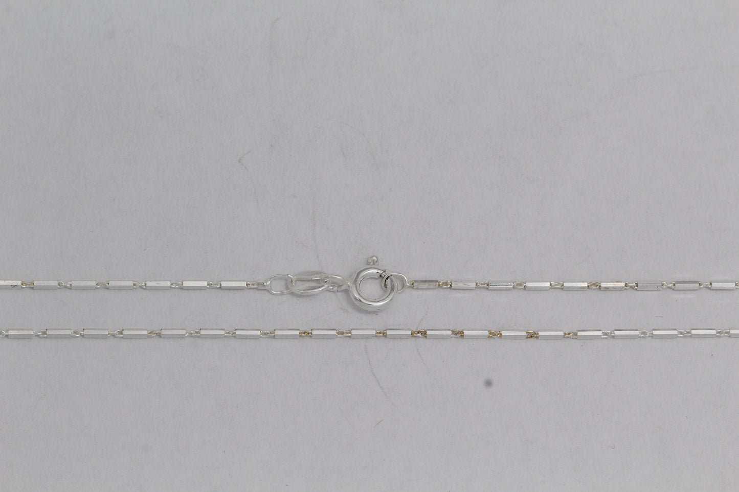 Sterling Silver, 1.1mm Width by 4.3mm Length, 18 Inch Regular Bar Chain with 6.0mm Width / Length by 1.4mm Thick, Smooth Spring Ring Clasp. Quantity Per Pack: 1 Piece.
