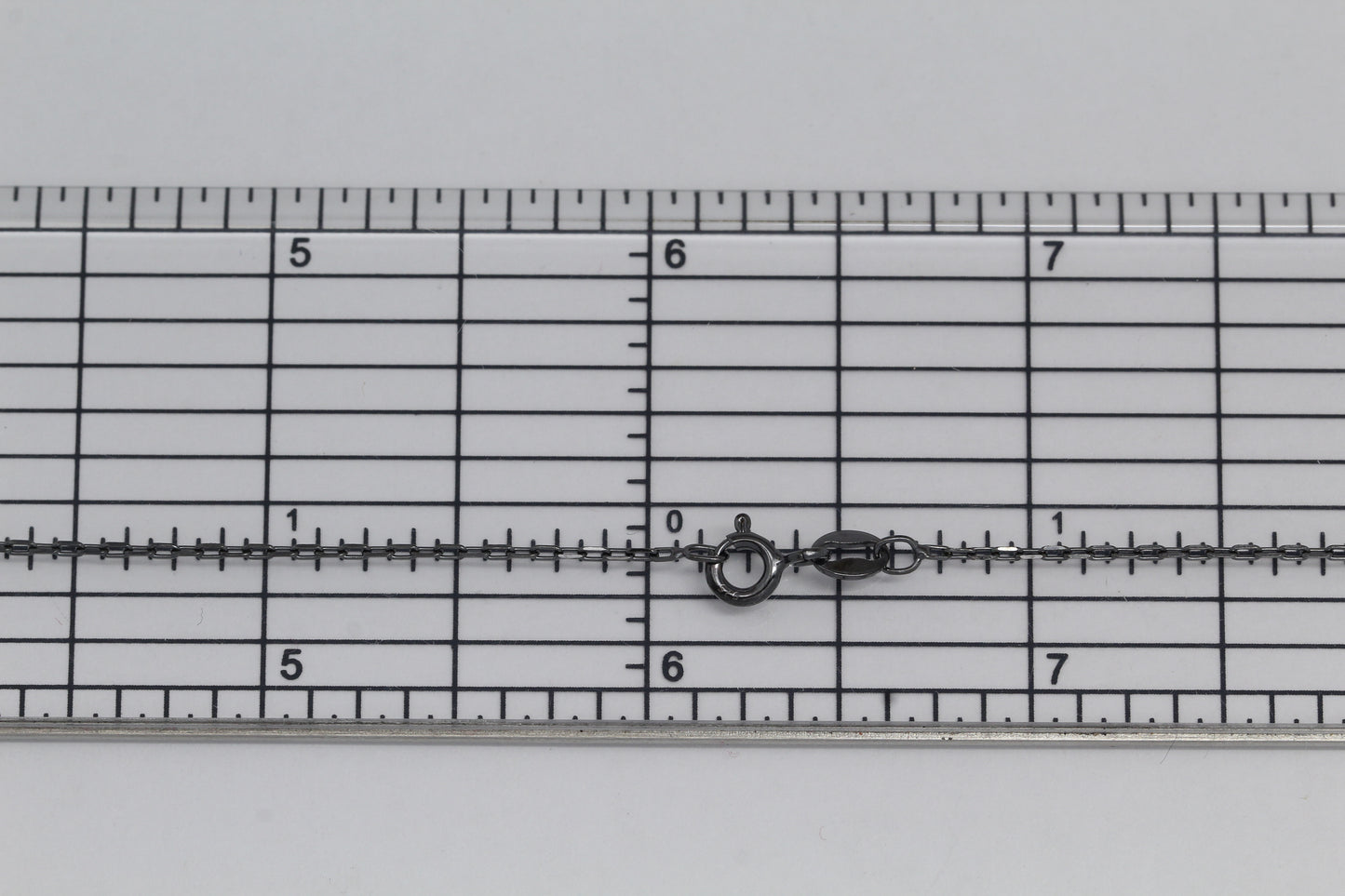 Sterling Silver Black Diamond, 1.2mm Width by 1.8mm Length, 18 Inch Flat Cable Chain with 6.0mm Width / Length by 1.4mm Thick, Smooth Spring Ring Clasp. Quantity Per Pack: 1 Piece.