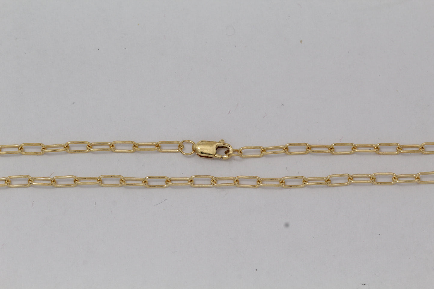 Gold Filled, 2.6mm Width by 5.8mm Length, 18 Inch Elongated Cable Chain with 8.5mm Length by 2.1mm Thick, Oval Trigger Lobster Clasp. Quantity Per Pack: 1 Piece.