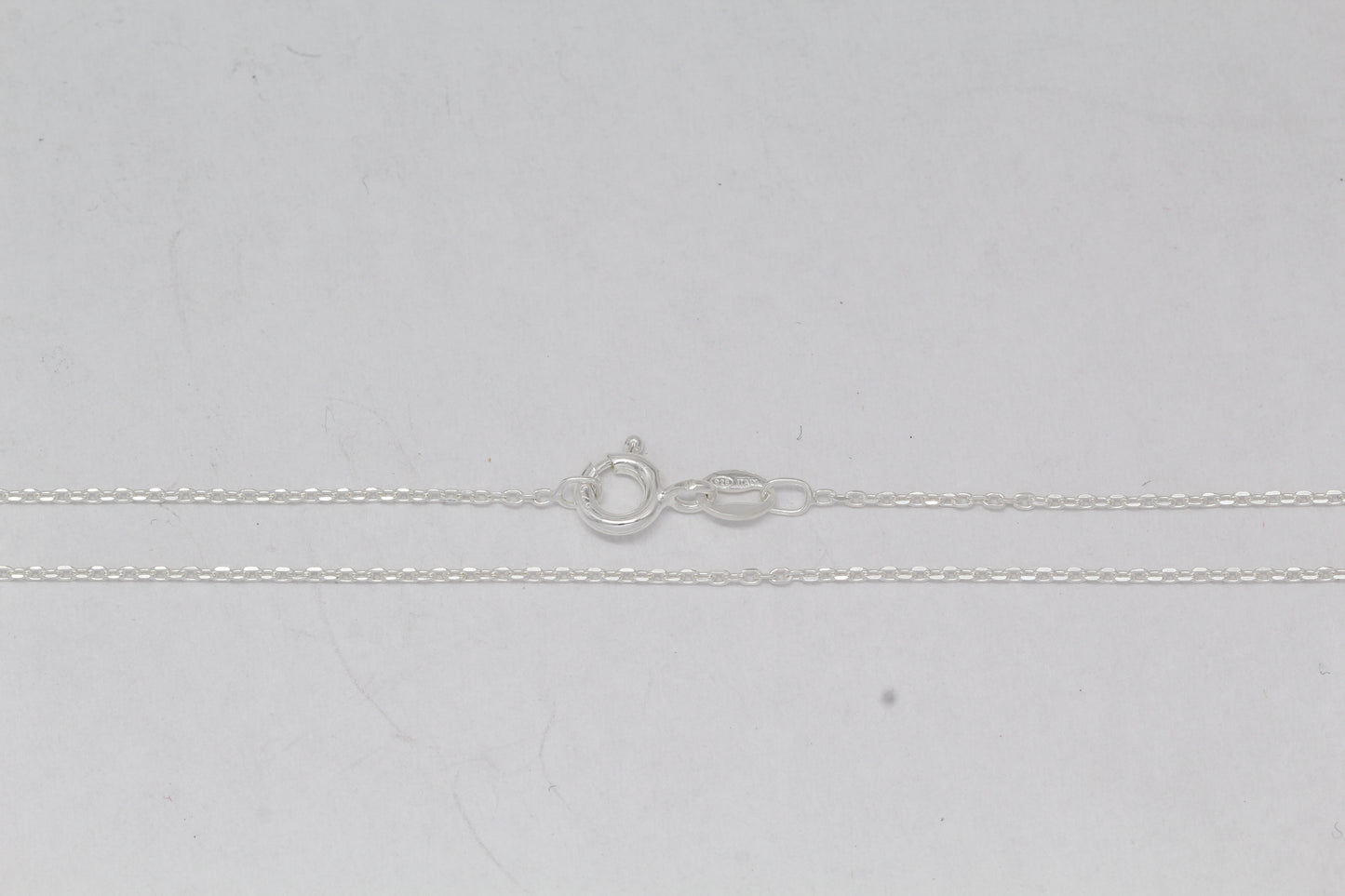 Sterling Silver, 1.2mm Width by 1.8mm Length, 18 Inch Flat Cable Chain with 6.0mm Width / Length by 1.4mm Thick, Smooth Spring Ring Clasp. Quantity Per Pack: 1 Piece.