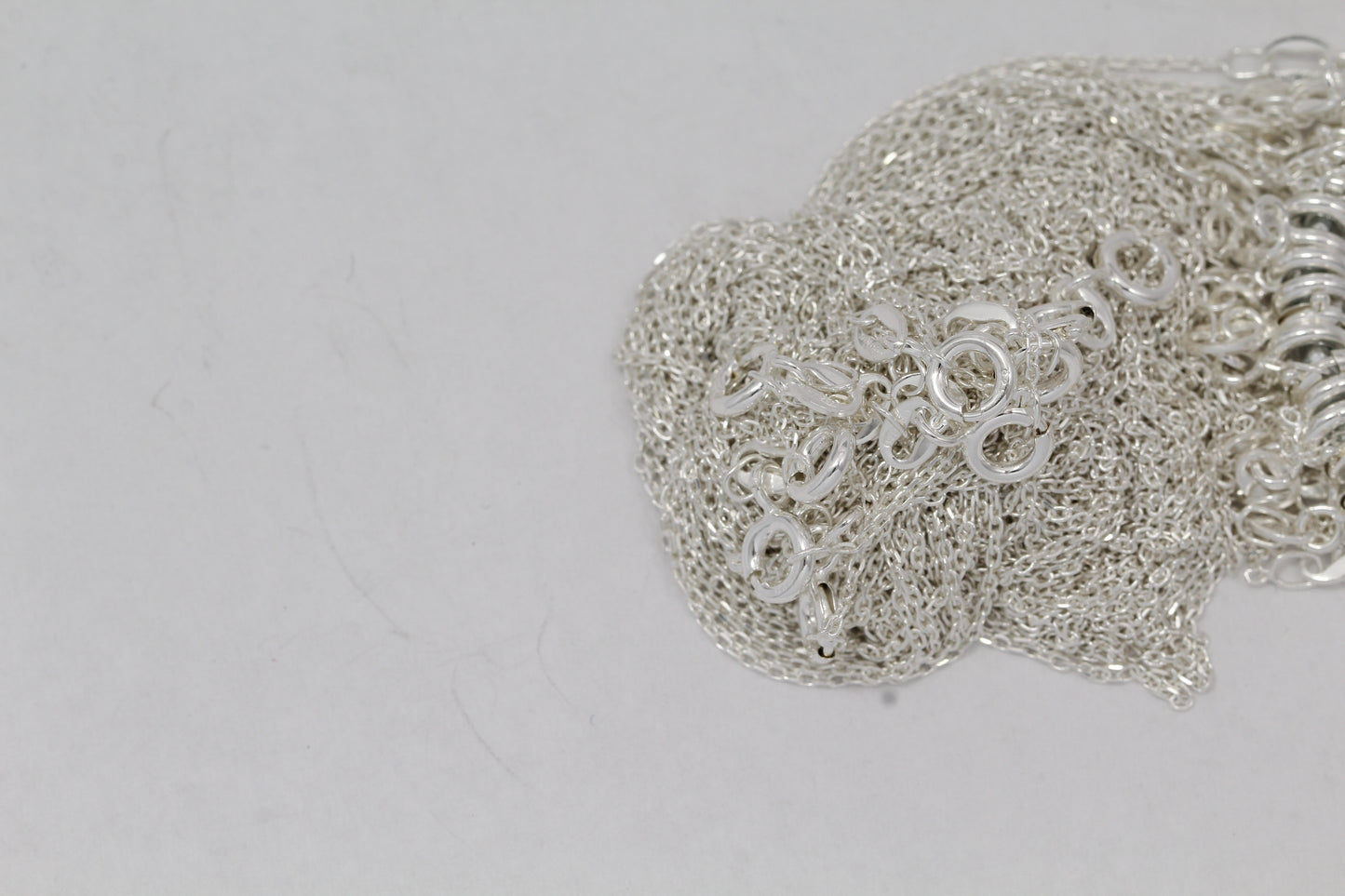 Sterling Silver, 1.2mm Width by 1.8mm Length, 18 Inch Flat Cable Chain with 6.0mm Width / Length by 1.4mm Thick, Smooth Spring Ring Clasp. Quantity Per Pack: 1 Piece.