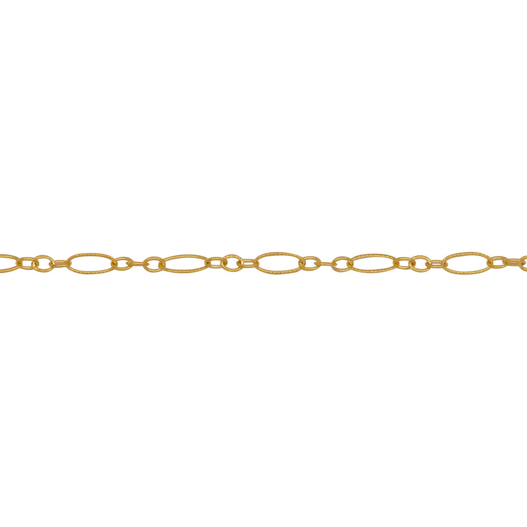 Chain by Foot. 14kt Gold Filled One of 2.5mm Width by 5.0mm Length, Longer Corrugated Oval Link Connected to Three of 1.5mm Width by 2.0mm Length, Smaller Oval Links with Middle Smaller Oval Link being Corrugated, Long and Short Chain. Price Per: 1 Foot.
