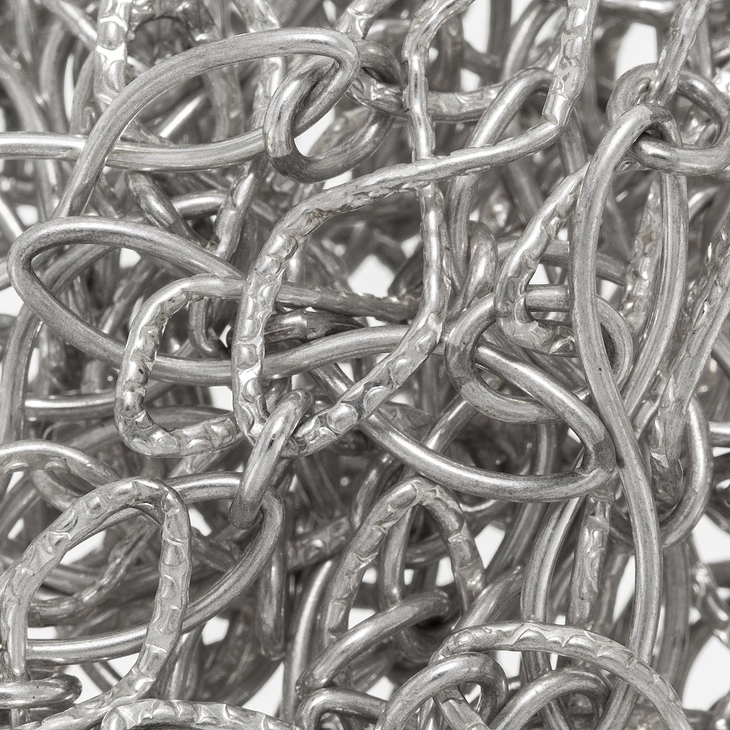 Sterling Silver 5.0mm Width by 20.0mm Length Textured and Smooth Figure 8 Links Connected to a 4.5mm Width by 6.0mm Length Small Oval Link, Figure 8 Chain. Price per: 1 Foot.