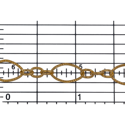 14kt Gold Filled One of 6.8mm Width by 11.0mm Length, Larger Corrugated Oval Link Followed by Three of 3.5mm Width by 4.7mm Length Smaller Links with Middle Smaller Link Being Corrugated, Long and Short Chain. Price per: 1 Foot.