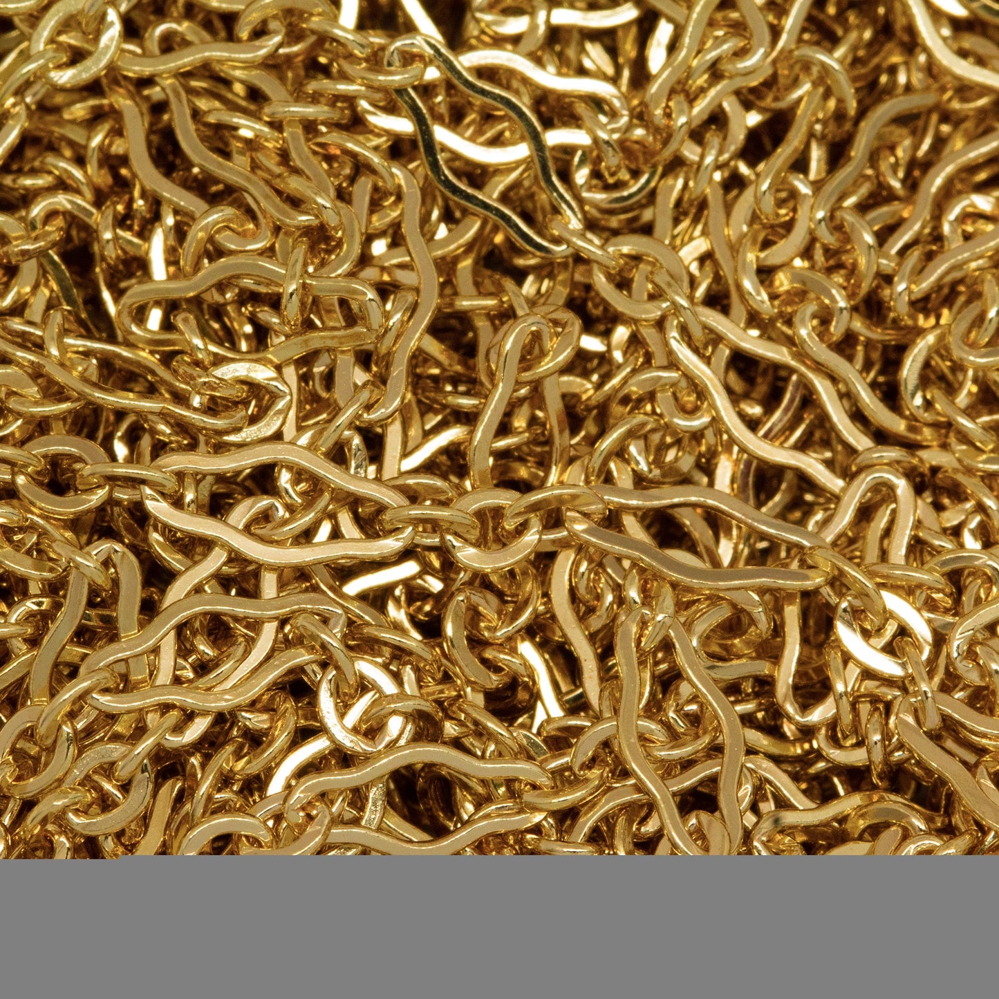 14kt Gold Filled 3.1mm Width by 6.7mm Length, Larger Flat Oval Link Followed by 2.2mm Width by 2.4mm Length, Three of Smaller Oval Flat Links, Long and Short Chain. Price per: 1 Foot.