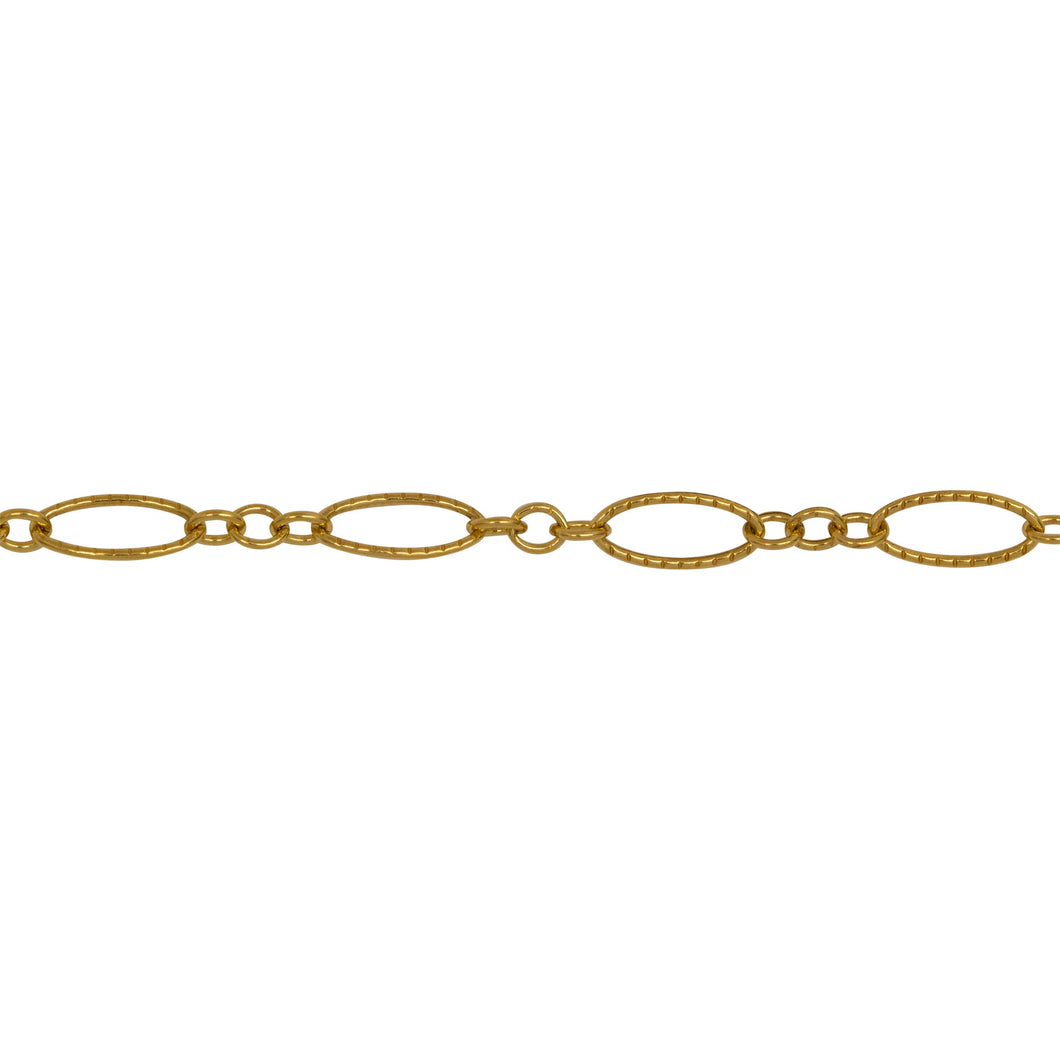 Chain by Foot. 14kt Gold Filled One of 4.1mm Width by 7.8mm Length Corrugated Long Oval Link Followed by Three of 2.5mm Width by 3.0mm Length Smaller Oval Links With Middle Smaller Oval Link Being Smooth, Long and Short Chain. Price per: 1 Foot.