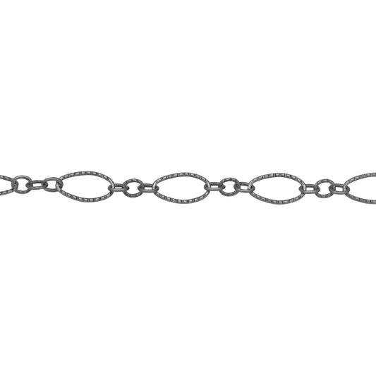 Chain by Foot. Sterling Silver Oxidized One of 4.1mm Width by 7.8mm Length Corrugated Long Oval Link Followed by Three of 2.5mm Width by 3.0mm Length Smaller Oval Links With Middle Smaller Oval Link Being Smooth, Long and Short Chain. Price per: 1 Foot.