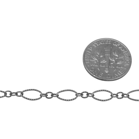 Sterling Silver Oxidized One of 4.1mm Width by 7.8mm Length Corrugated Long Oval Link Followed by Three of 2.5mm Width by 3.0mm Length Smaller Oval Links With Middle Smaller Oval Link Being Smooth, Long and Short Chain. Price per: 1 Foot.