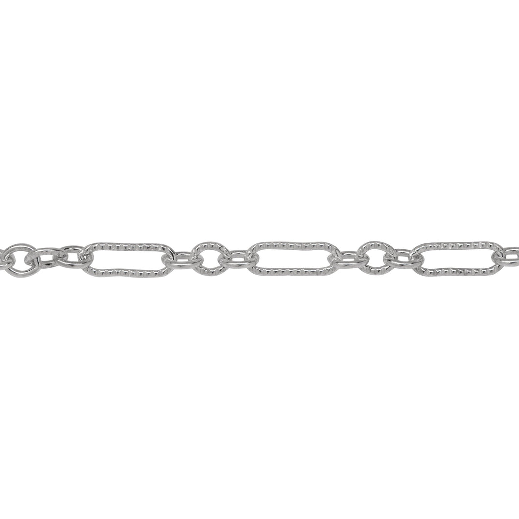 Chain by Foot. Sterling Silver One of 3.1mm Width by 9.4mm Length Corrugated Elongated Oval Link Followed by Three of 3.1mm Width by 4.0mm Length Smooth Oval Links with Middle Oval Link being Corrugated, Long and Short Chain. Price per: 1 Foot.