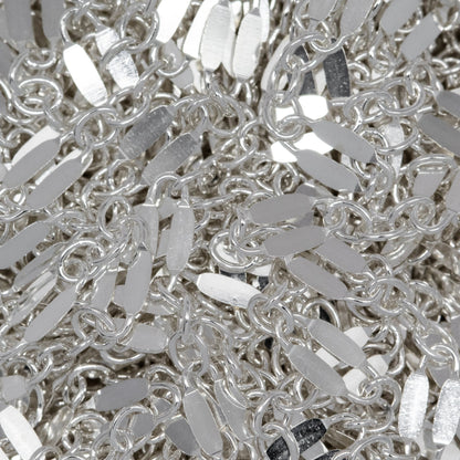 Sterling Silver 2.4mm Width by 5.1mm Length, Dapped Elongated Oval Link Followed by Three of 1.7mm width by 2.1mm length Smaller Oval Links, Long and Short Chain. Price per: 1 Foot.