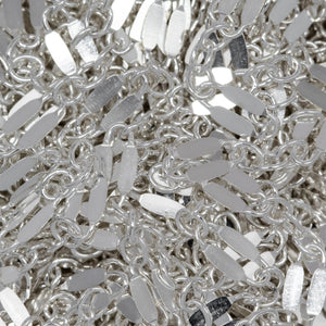 Sterling Silver 2.4mm Width by 5.1mm Length, Dapped Elongated Oval Link Followed by Three of 1.7mm width by 2.1mm length Smaller Oval Links, Long and Short Chain. Price per: 1 Foot.