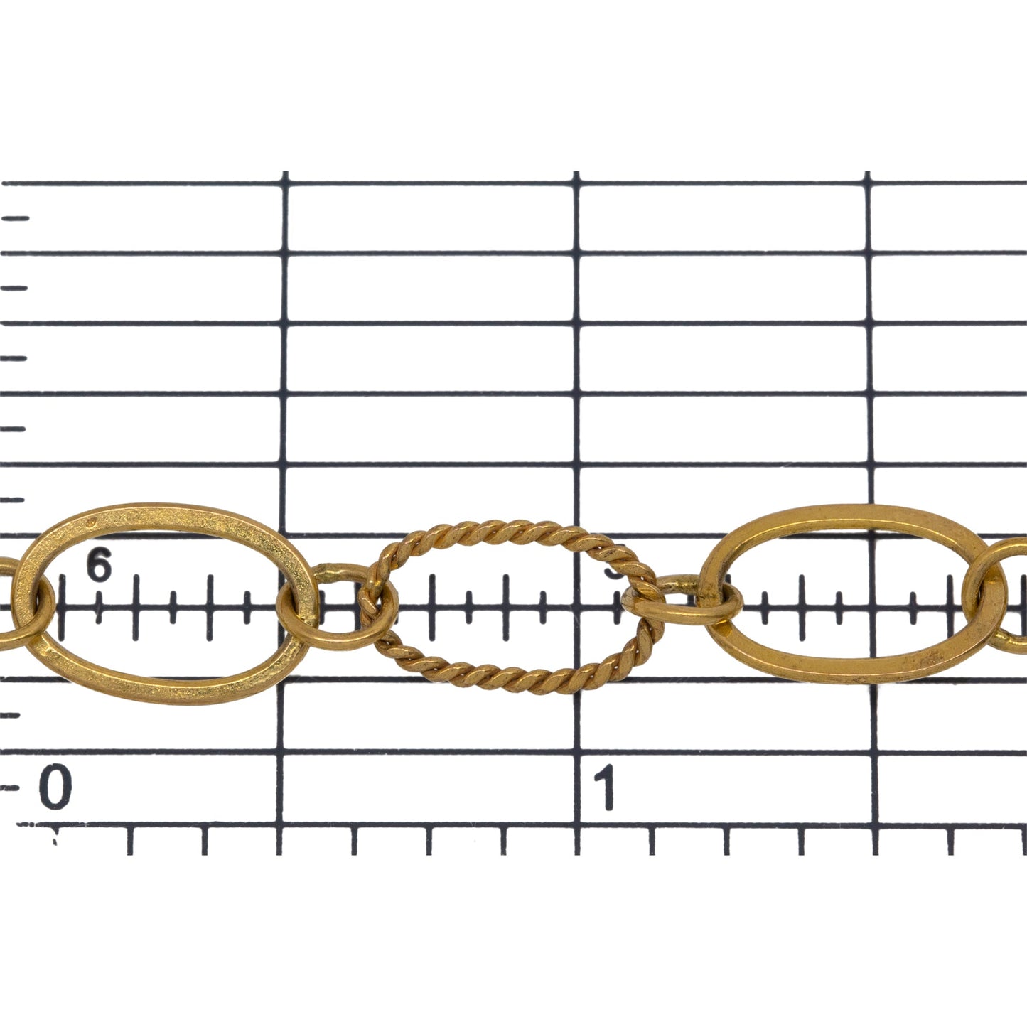 14kt Gold Filled Flat and Twisted 8.06mm Width by 13.20mm Length Oval Links Connected by 5.2mm Open Ring, Long and Short Chain. Price per: 1 Foot.