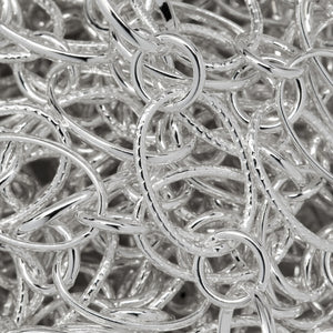 Sterling Silver 7.5mm Width by 10.8mm Length Oval Rolo Link And Textured Oval Links Connected to 5.2mm Closed Circle Link, Long and Short Chain. Price per: 1 Foot.