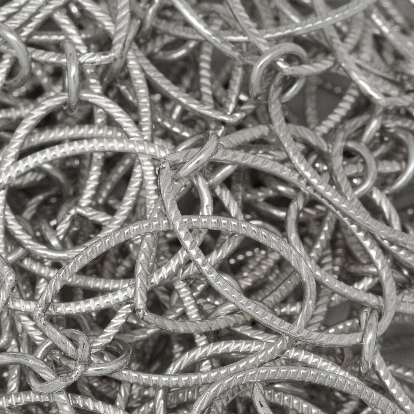 Sterling Silver 12.9mm Width by 20.9mm Length Corrugated Oval Link Followed by 5.5mm Width / Length Smooth Close Ring, Long and Short Chain. Price per: 1 Foot.