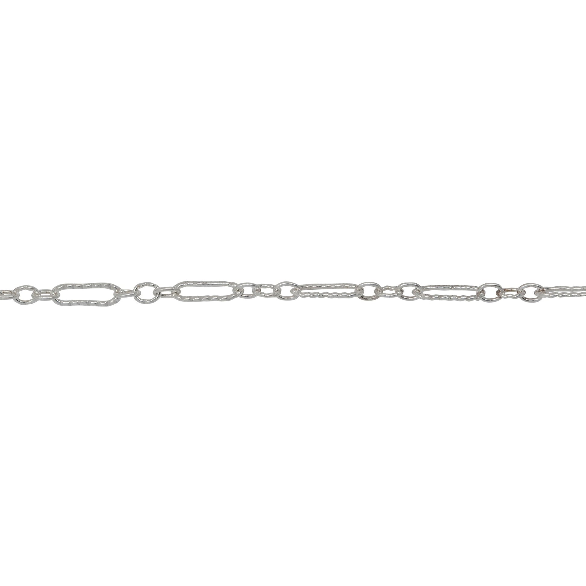 Chain by Foot. Sterling Silver Three of 1.7mm Width by 2.3mm Length Smaller Oval Links With Middle Link Being Corrugated Oval Link, Followed by 1.8mm Width by 5.8mm Length Larger Corrugated Elongated Oval Link, Long and Short Chain. Price per: 1 Foot.