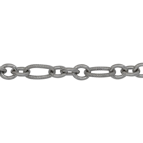 Chain by Foot. Sterling Silver Rhodium Plated 5.08mm Width by 9.84mm Length Larger Textured Oval Link Followed by Three of 4.9mm Width by 6.09mm Length Smaller Smooth Oval Links, Long and Short Chain. Price per: 1 Foot.