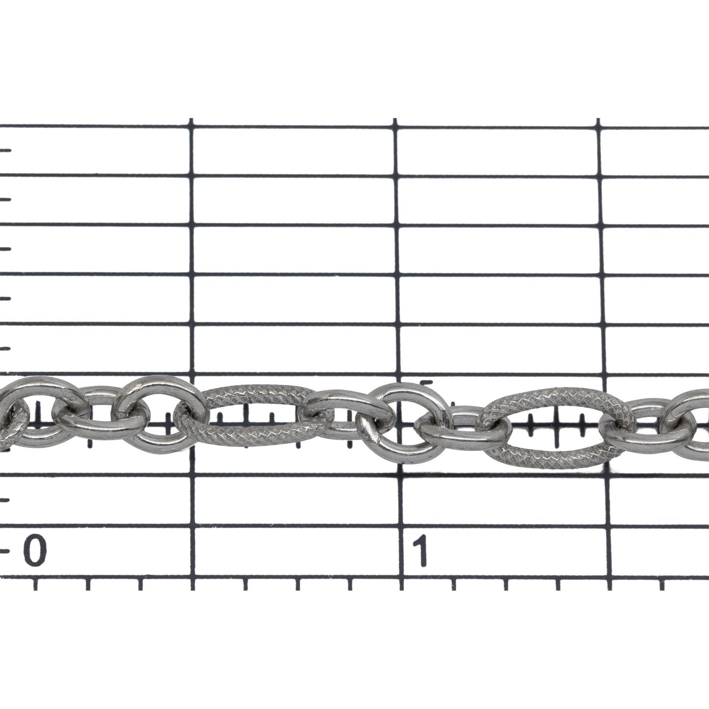 Sterling Silver Rhodium Plated 5.08mm Width by 9.84mm Length Larger Textured Oval Link Followed by Three of 4.9mm Width by 6.09mm Length Smaller Smooth Oval Links, Long and Short Chain. Price per: 1 Foot.