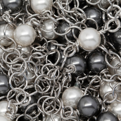 Sterling Silver Rhodium Plated Two of 4.12mm Width / Length Smooth Circle Connected with Two of 6.02mm Width / Length Swarovski Pearls, followed by Six of 5.34mm Width / Length Smooth Circle Links of Circle Chain. Price per: 1 Inch.