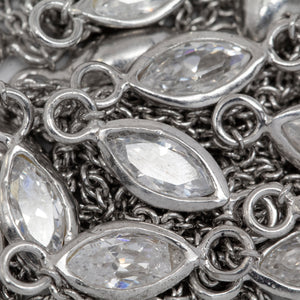 Sterling Silver Rhodium Plated 4.15mm by 8.76mm White CZ Oval Bezel Set Link Connected by 2.72mm Smooth Circles on Each Side of Bezel Set, followed by 1.33mm by 1.5 Smooth Cable Chain Every 2 Inches, Bezel Set Chain. Price per: 1 Inch.