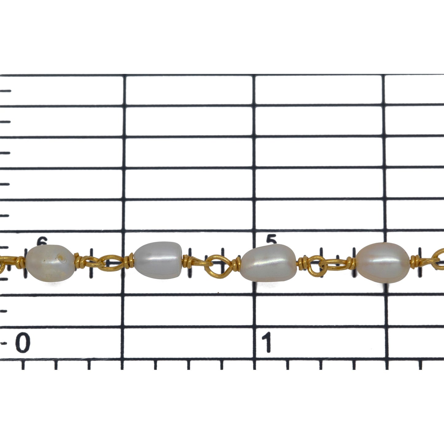Brass Gold Plated 3.85mm Width by 5.56mm Length White Rice Pearl Chain. Price per: 1 Inch.