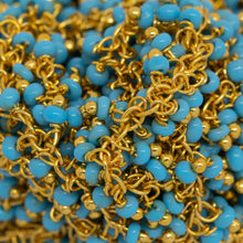 Load image into Gallery viewer, Brass Gold Plated 1.56mm Width by 2.75mm Length Cable Chain, With Two of 2.0mm Width by 1.6mm Length Turquoise Seed Bead Hanging off the Chain, Gem Stone Chain. Price per: 1 Inch.
