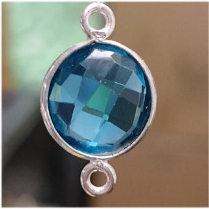 Stone Connectors & Drops. Sterling Silver 11.0mm Width / Length, Blue Water Quartz Stone, Round Connector with 3.3mm Closed Ring on each side. Quantity Per Pack: 1 Piece.