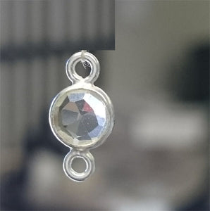 Sterling Silver, 10.7mm Width by 3.6mm Length by 6.7mm Height, Round Connector with Clear CZ. Quantity Per Pack: 4 Pieces.